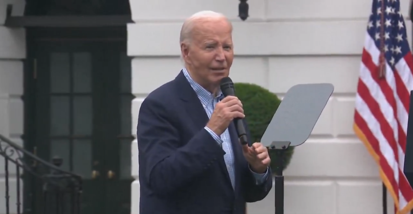 Biden looking confused while speaking to crowd outside of the White House amid Democrat rebellion against him as a candidate